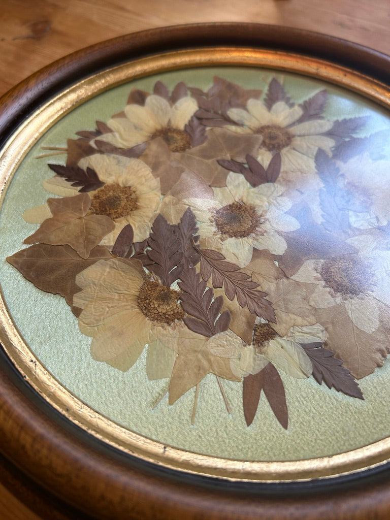 Vintage Round Framed Pressed Flowers on Silk Background