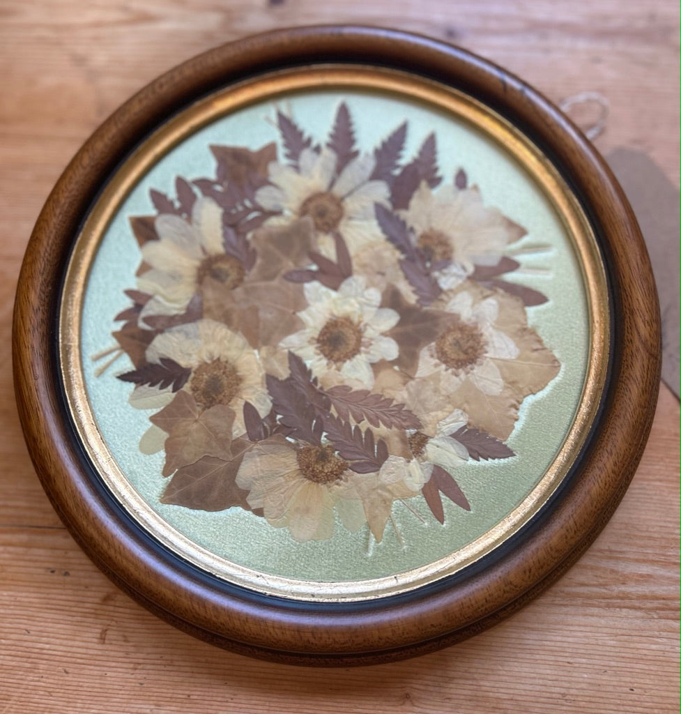 Vintage Round Framed Pressed Flowers on Silk Background