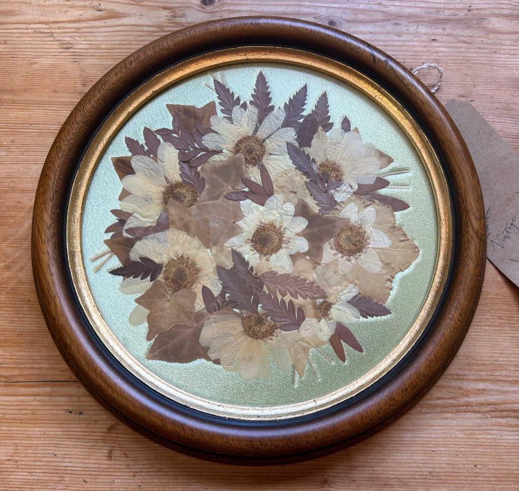 Vintage Round Framed Pressed Flowers on Silk Background