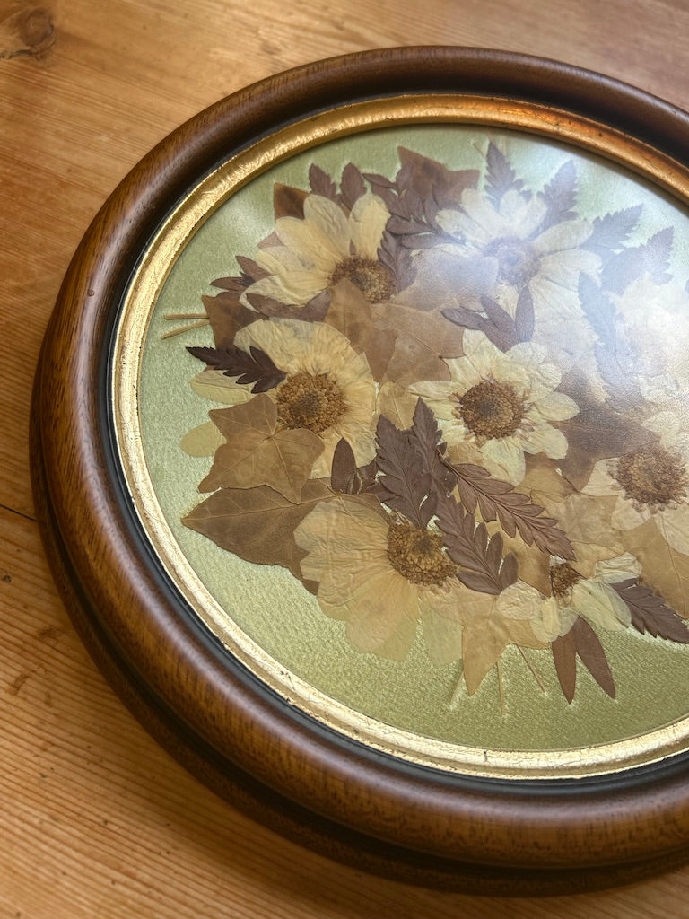 Vintage Round Framed Pressed Flowers on Silk Background