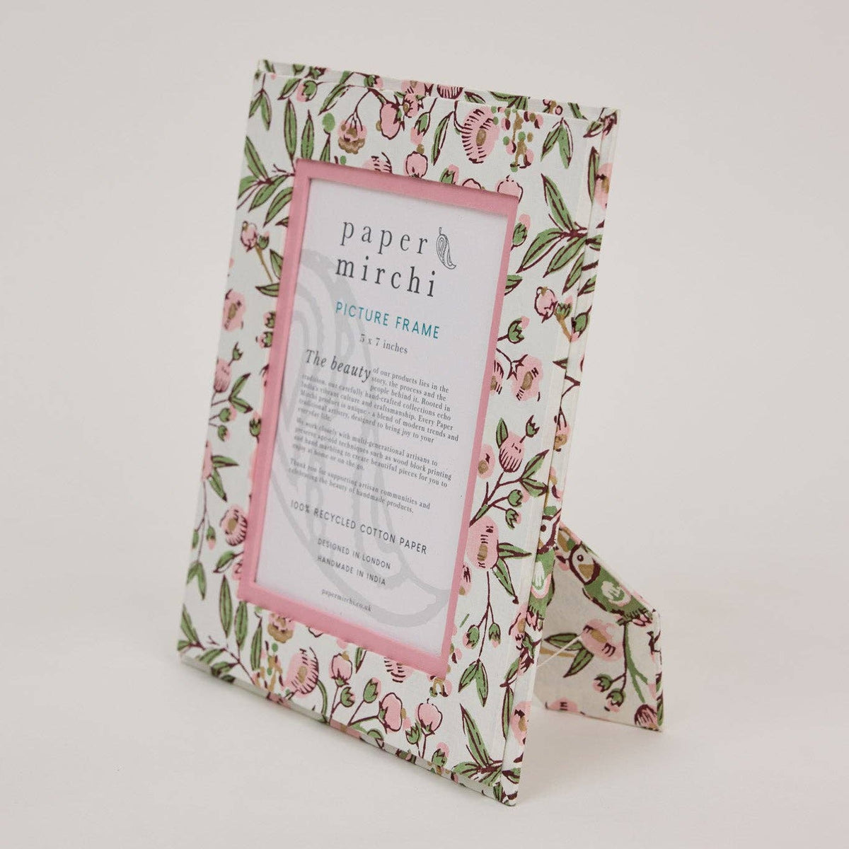 Floral patterned picture frame with 'paper mirchi' branding on a white background