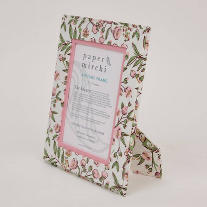 Floral patterned picture frame with 'paper mirchi' branding on a white background