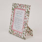 Floral patterned picture frame with 'paper mirchi' branding on a white background