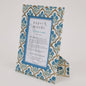 Decorative picture frame with floral pattern on a white background